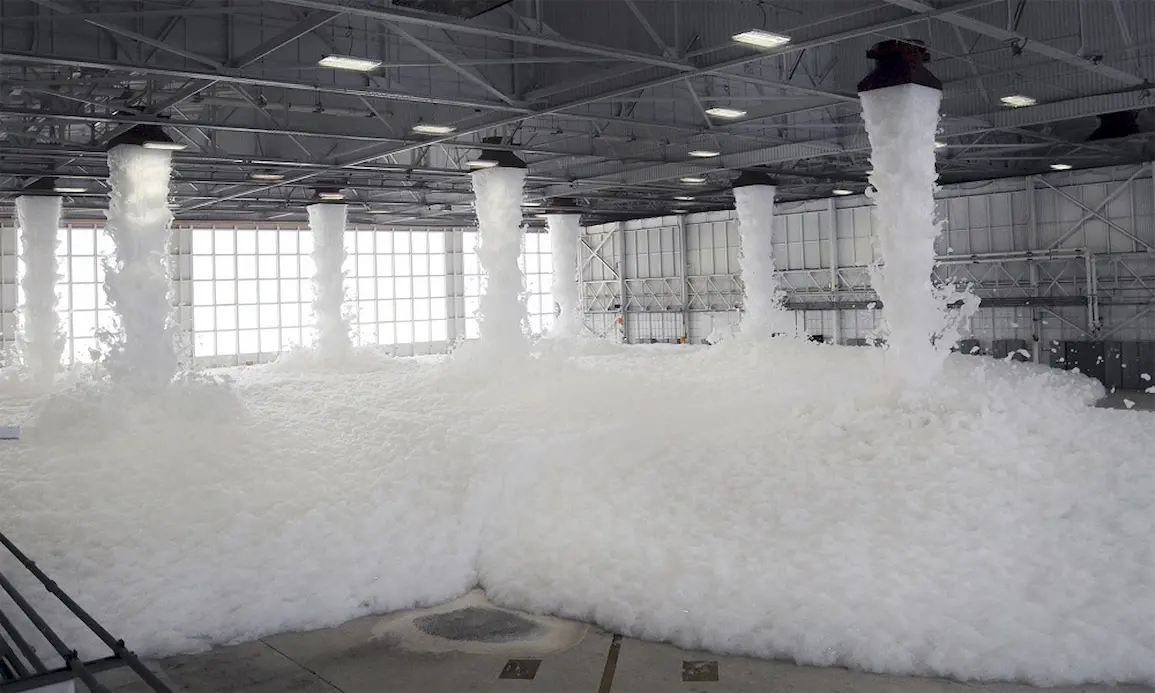 Active foam firefighting system suppressing fire in a warehouse