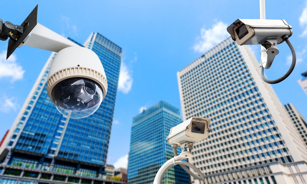 Various types of surveillance cameras including dome, bullet, PTZ, and IP cameras used in modern security systems